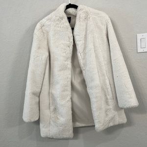 White faux fur coat